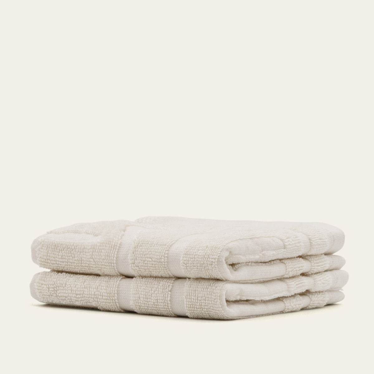 Australian cotton towels, folded light beige towels with textured stripe detail