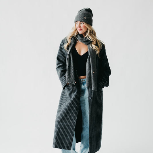 Charcoal cashmere wrap with matching ribbed knit beanie, scarf draped around neck