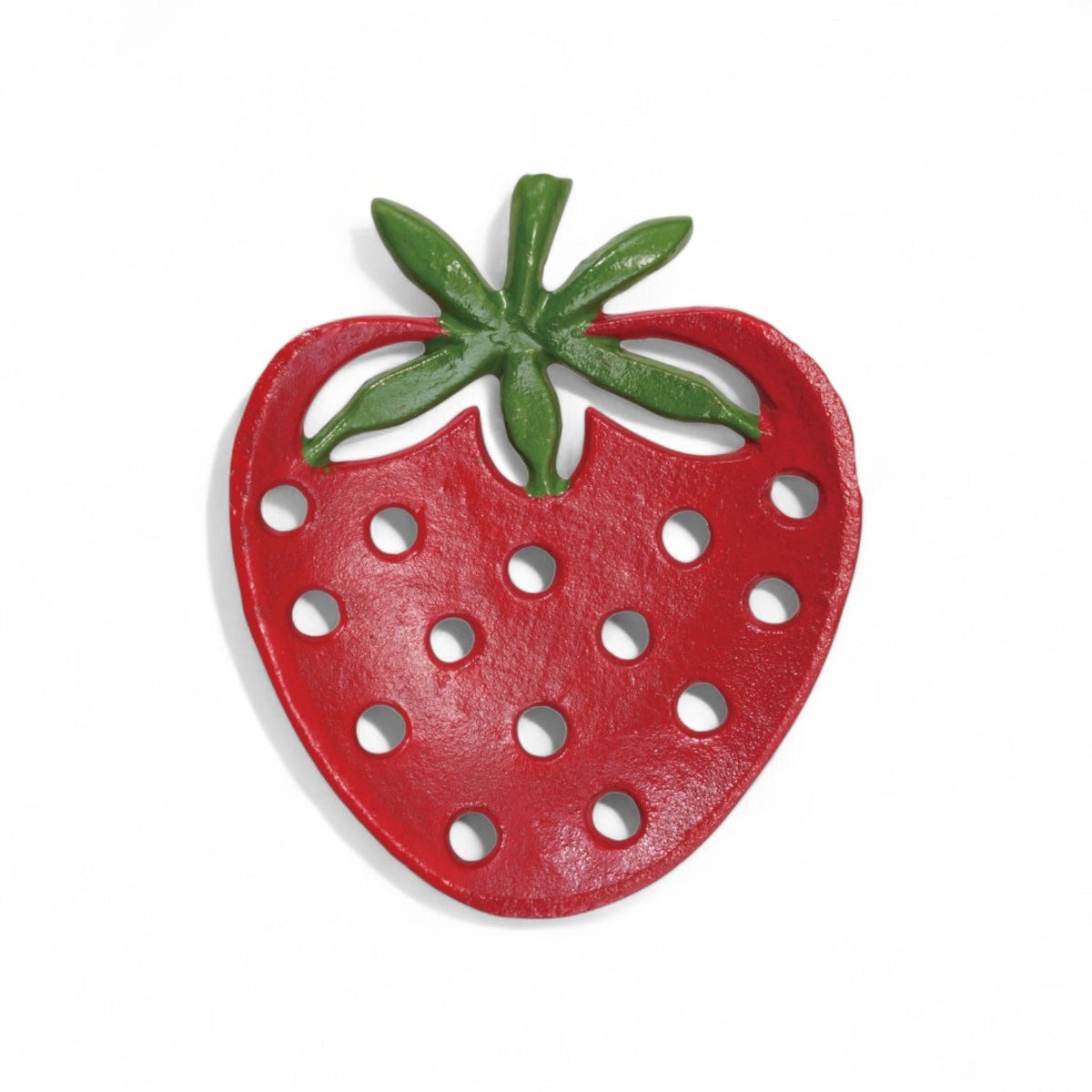 Red cast iron strawberry-shaped soap dish with green leaves and drainage holes