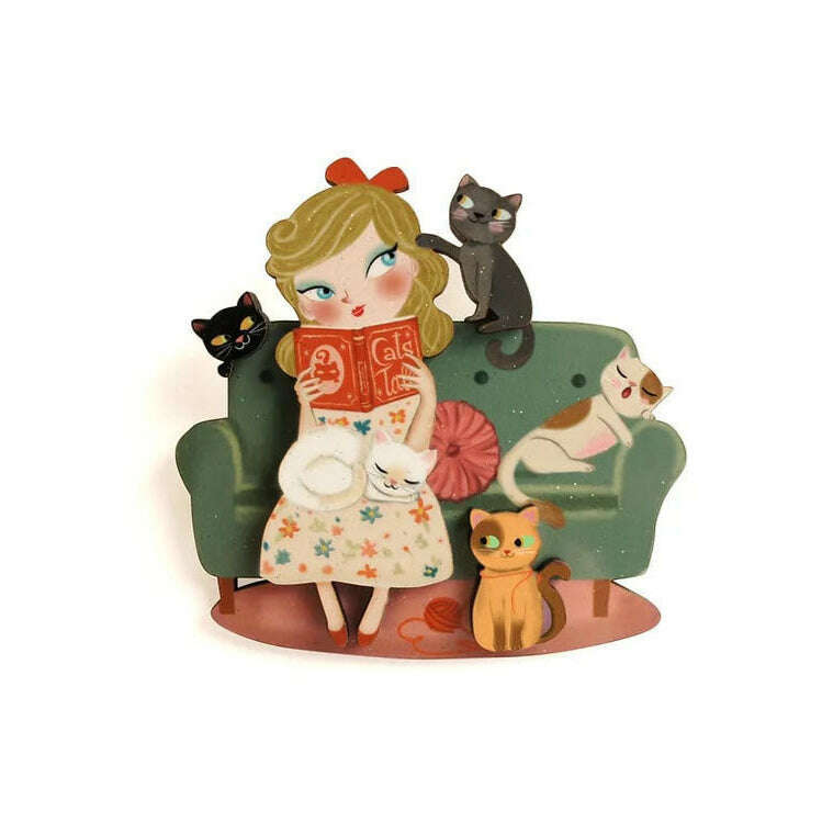 Laliblue cat lover brooch: girl reading book with cats on green rocking chair