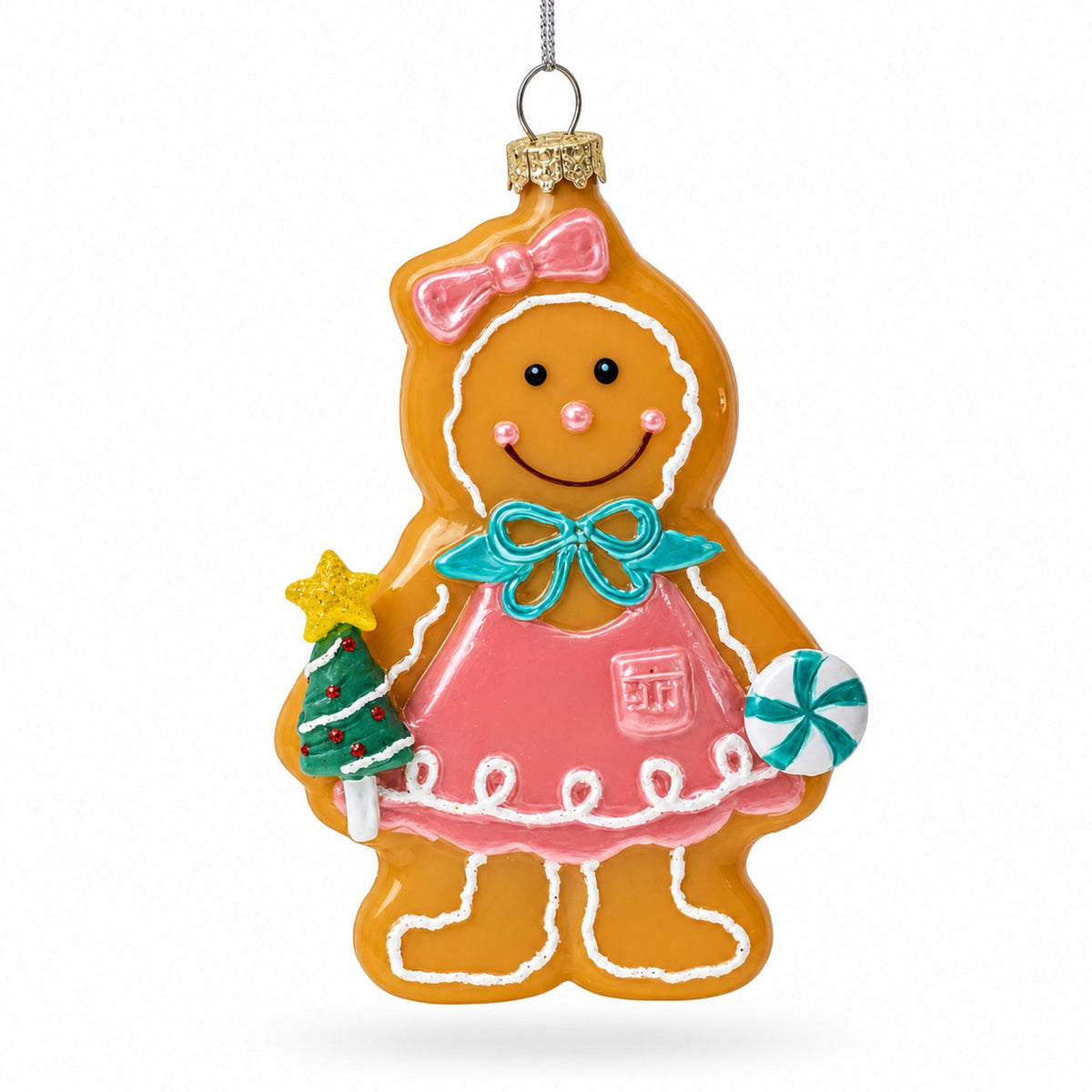 Glass gingerbread girl ornament with pink dress, teal bow, and tiny Christmas tree charm