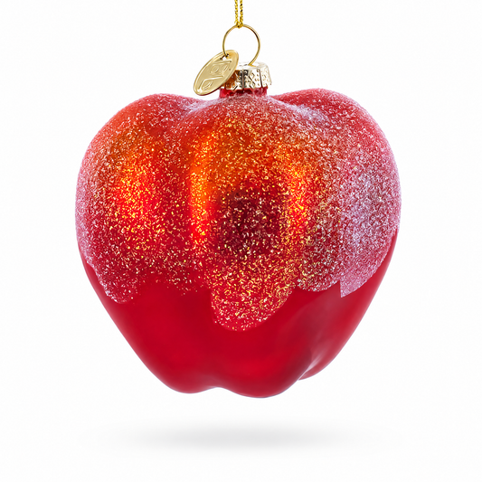 Red glitter glass apple ornament with heart-shaped cutout and gold hanging loop