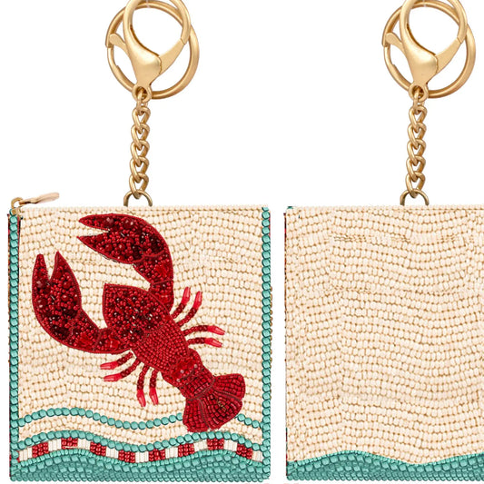 Beaded coin purse with red crab applique, gold-tone key ring; light beige with teal trim