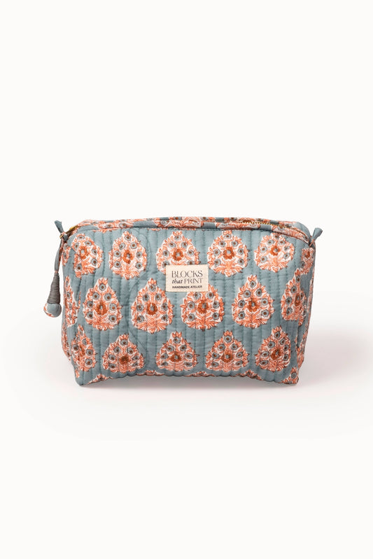 Quilted travel pouch with terracotta buta block print, zip-top, and “Blocks that Print” label