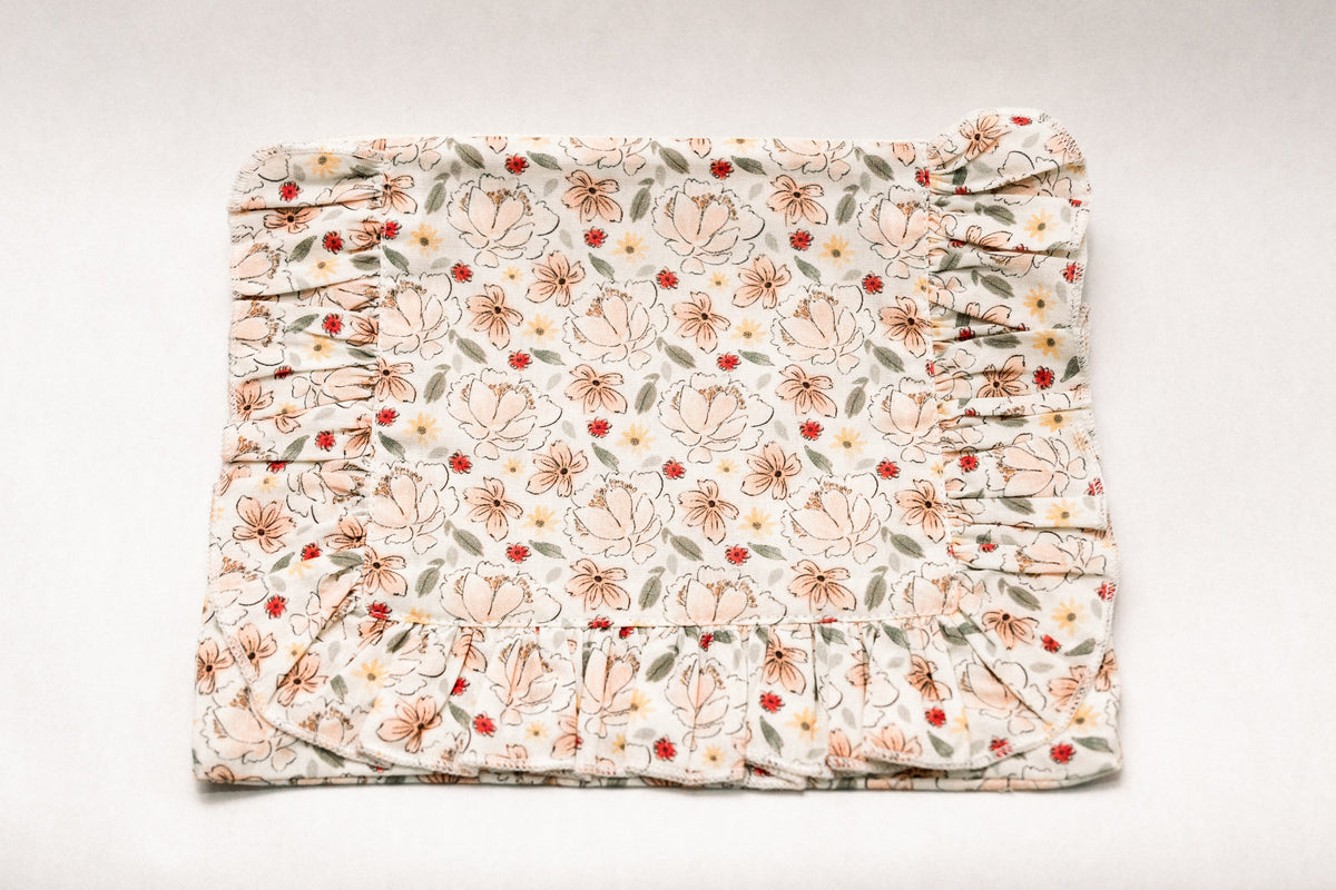 Primrose Garden floral ruffle zipper pouch with gathered ruffle hem, cream print