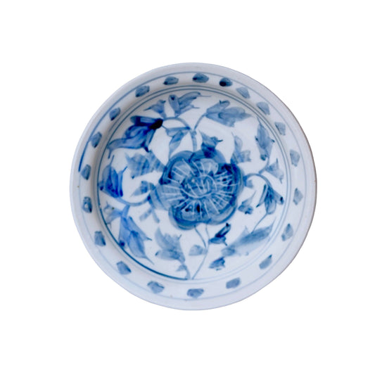 Small blue and white porcelain peony dish with blue floral border and center medallion