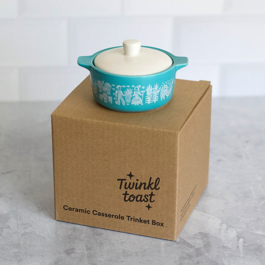 Blue ceramic casserole trinket box with white lid on a Twinkle Toast box