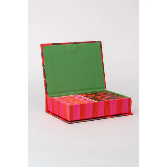 Playing card set open box with green tray and pink/red striped card decks