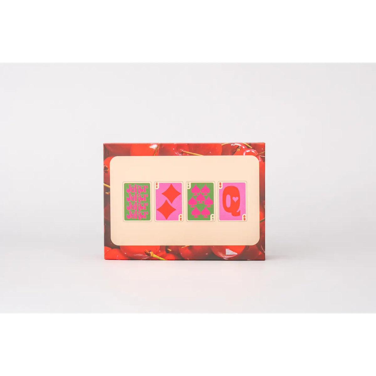 Playing card set box showing colorful card backs and faces in cherry print