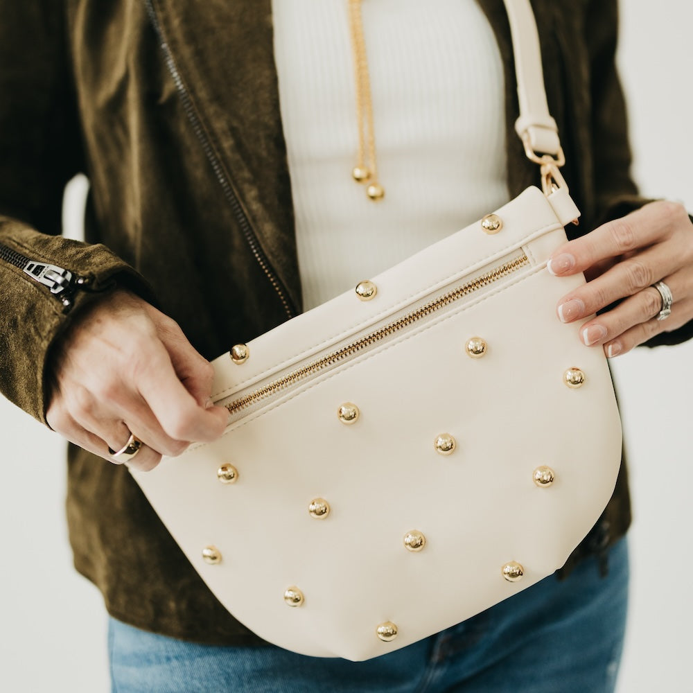 Cream faux-leather bum bag with gold studs and front zipper
