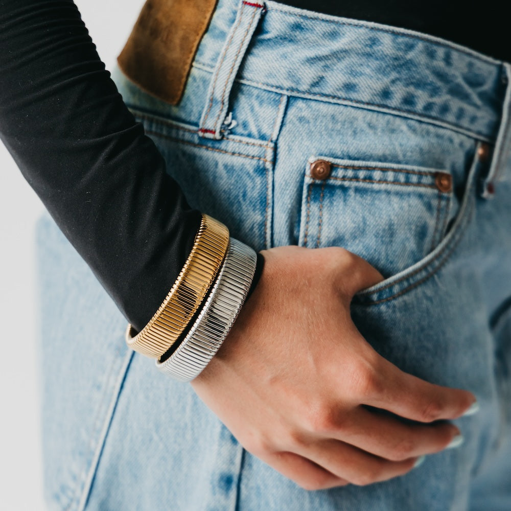 Chunky bangle bracelet set, ribbed gold and silver on wrist