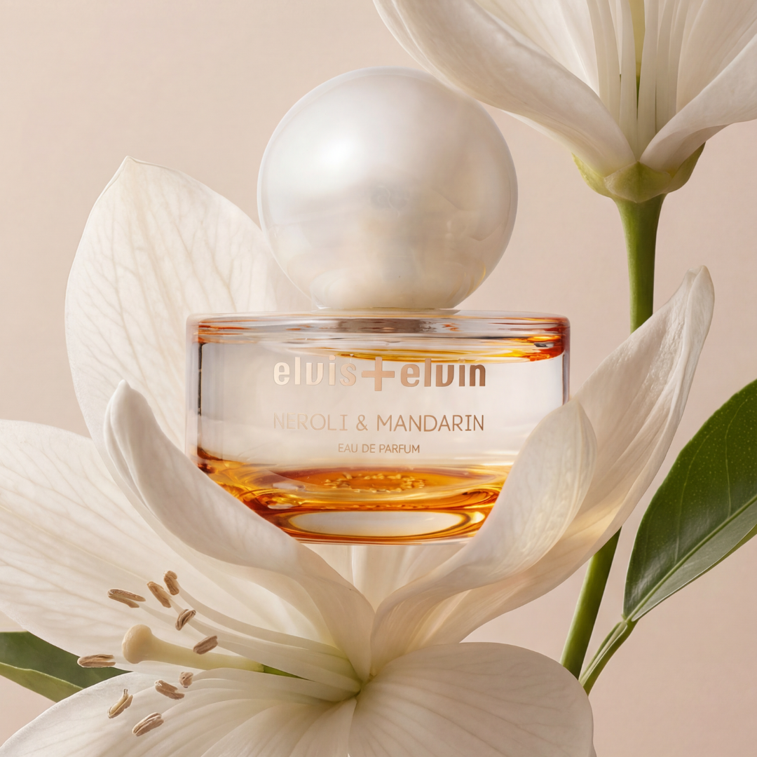 Eau de parfum bottle with amber glass and white flowers, round glass cap