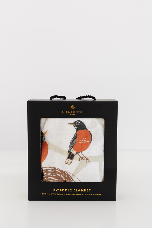 Swaddle blanket gift box with window showing bird print fabric in white and yellow