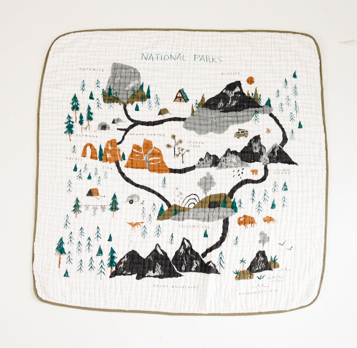 National Parks quilt on white with map-style mountains, forests, and tan trim border