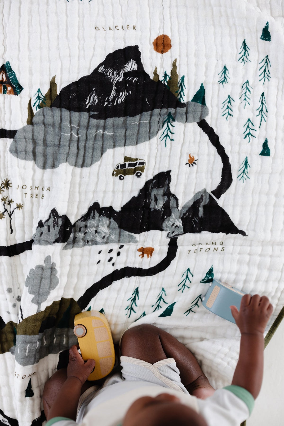 National Parks quilt face with black mountains, pine trees, and orange tents