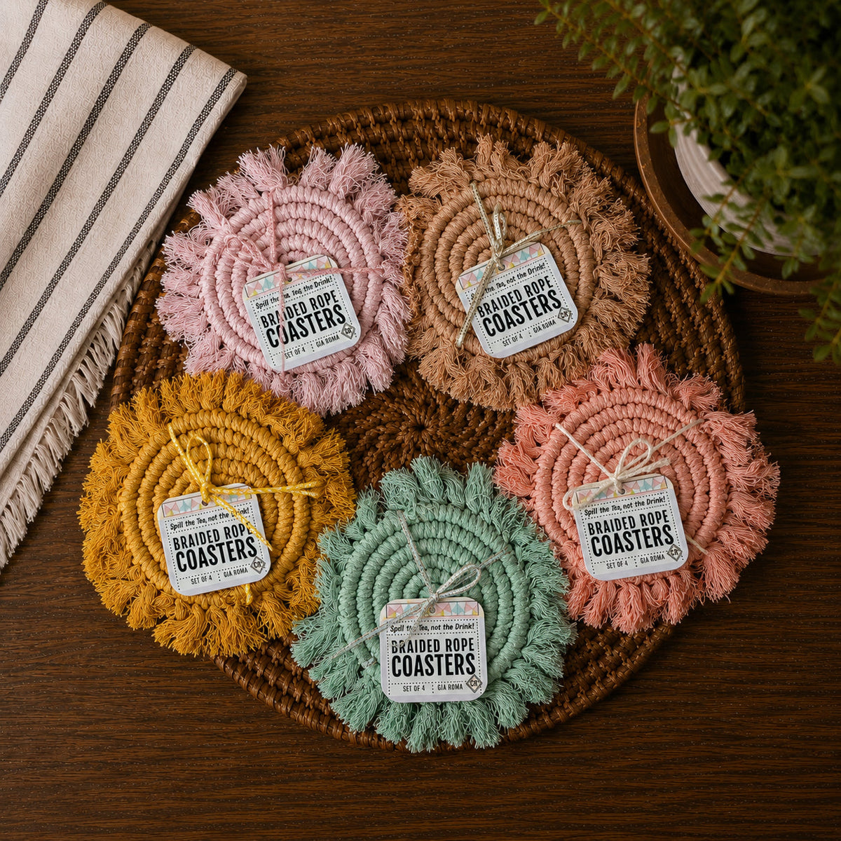 Assorted braided rope coasters set with round spirals in pink, tan, yellow, and green