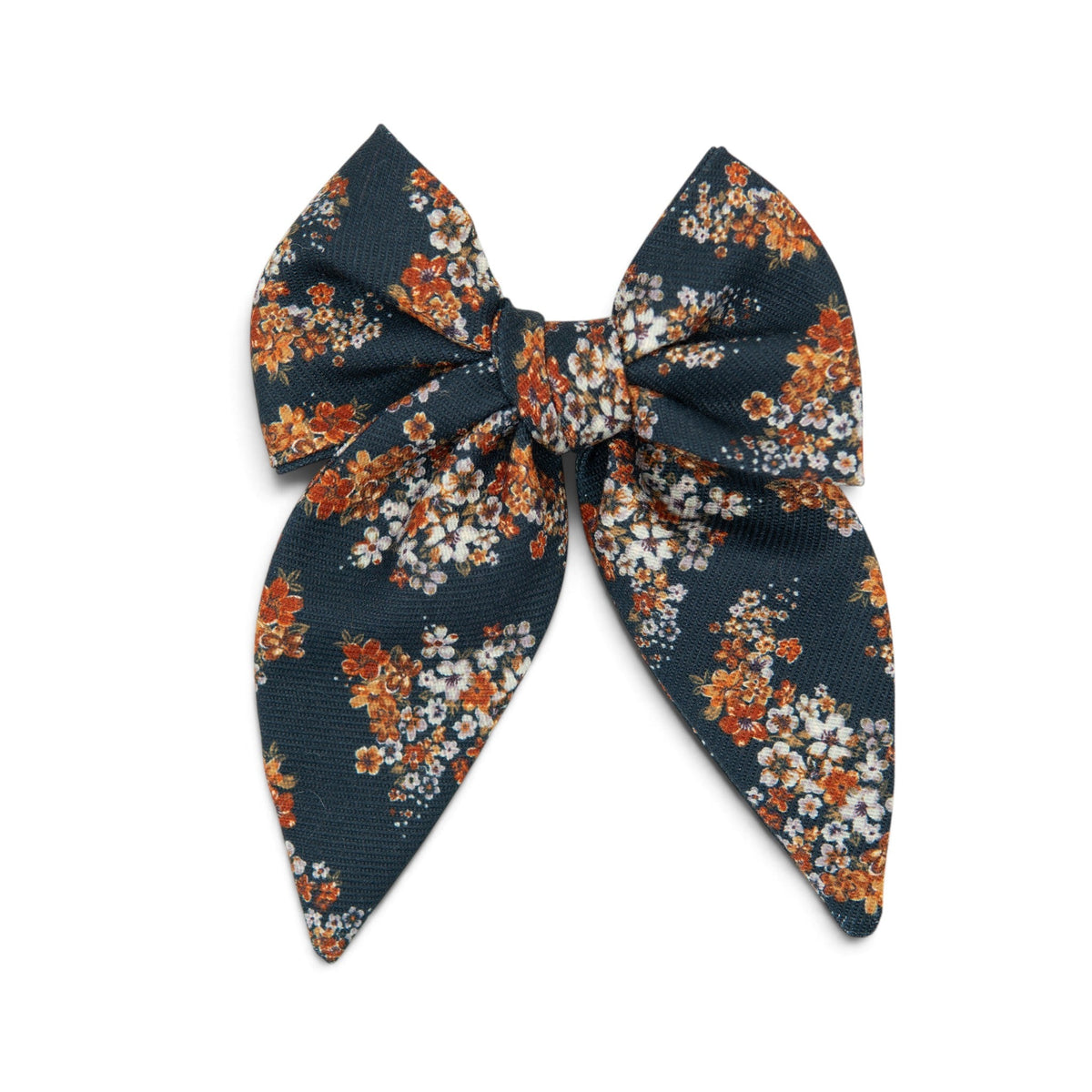Floral hair bow with dark navy fabric and orange, white, and light blue flower print