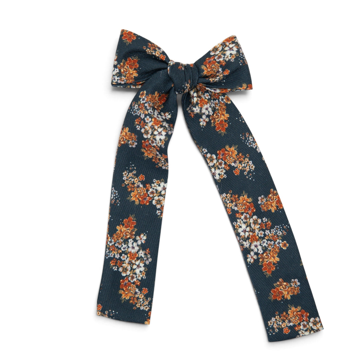 Navy floral lady hair bow with orange and white blossoms and long ribbon tails