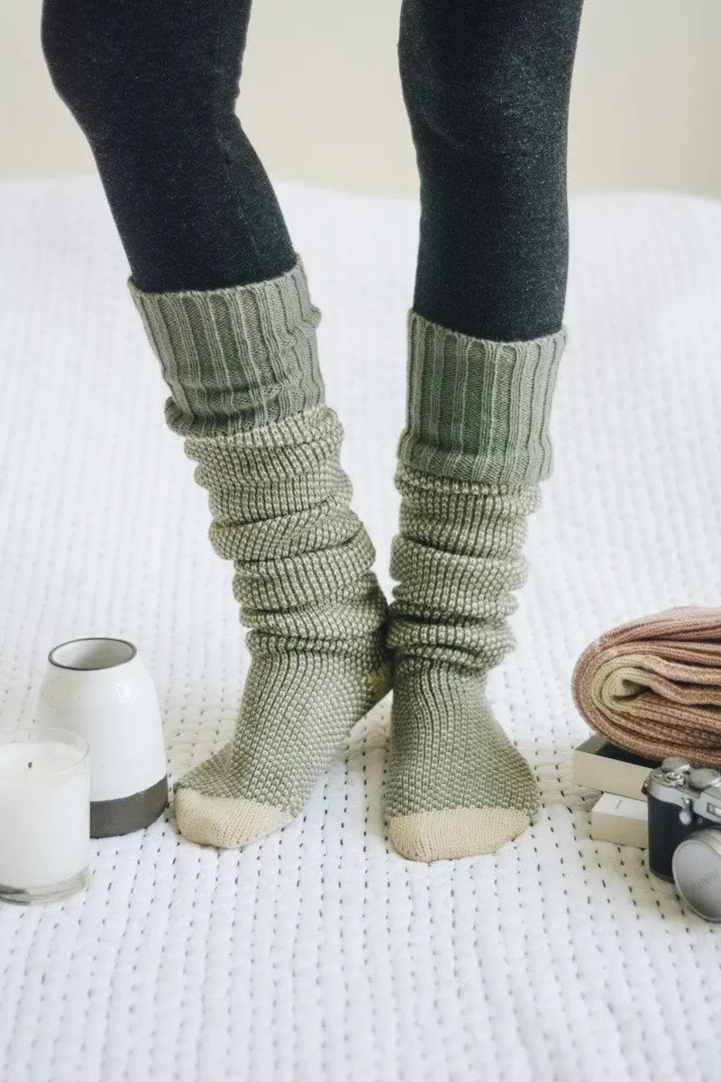Ribbed knit lounge socks in sage green with cream toes and rolled ribbed cuffs