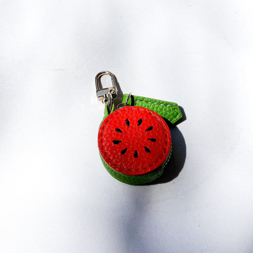 Watermelon-shaped fabric keychain charm with metal clasp and green strap