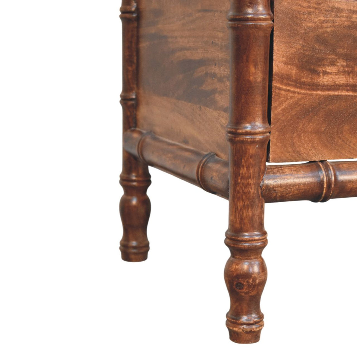 Close-up of brown bamboo-frame wood nightstand leg and drawer rail