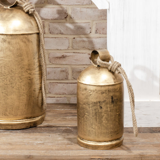 Gold distressed metal bell with braided rope handle, rounded top loop
