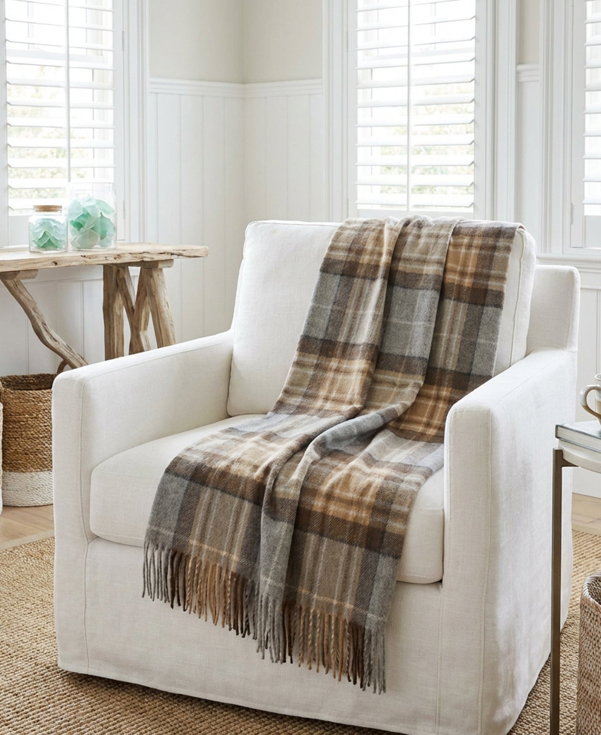 Plaid pure new wool throw blanket on white armchair, gray and tan weave, fringes