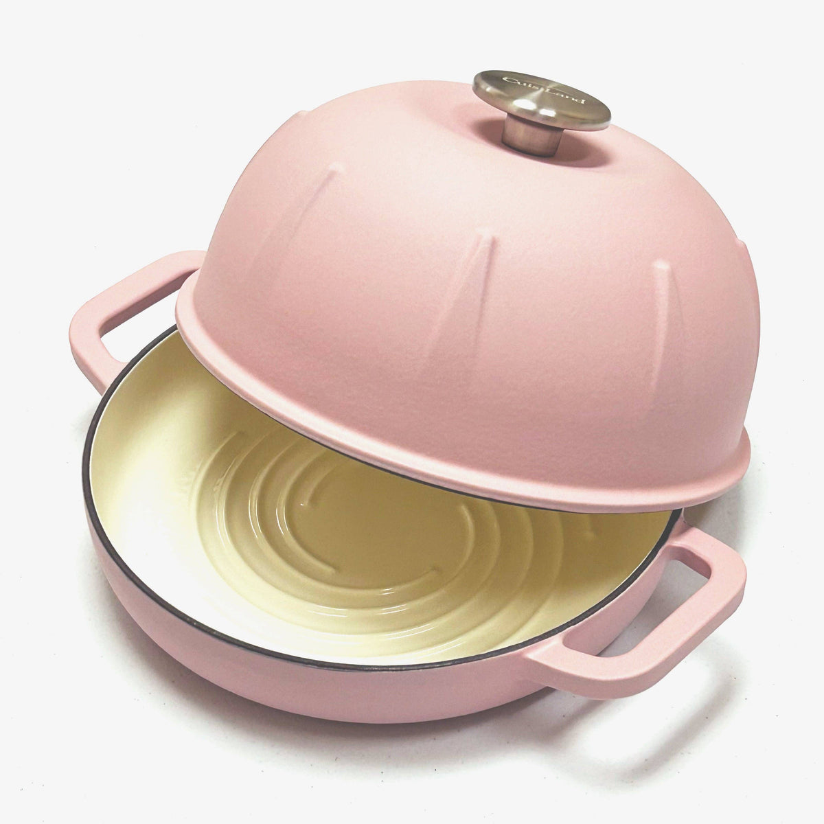 Pink enamel-style cast iron bread cloche with dome lid and open base