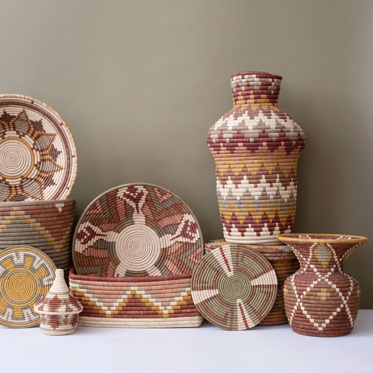 Woven coffee basket set with lidded jars, stacked coasters, and small spice-size baskets