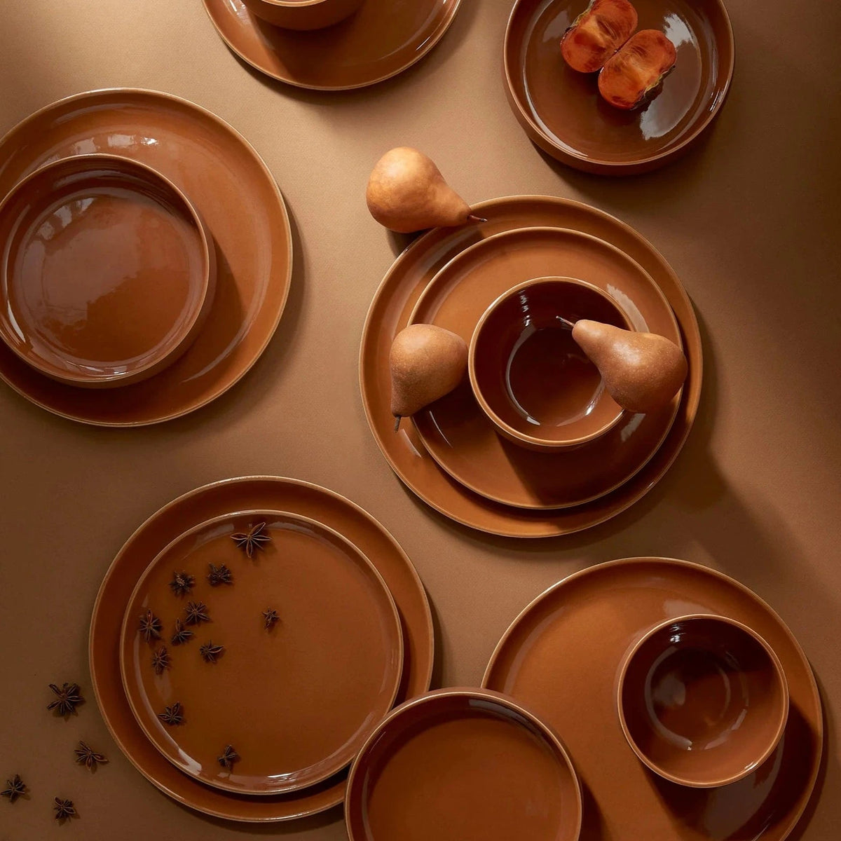 Terracotta dinnerware set: round dinner plates, side plates, and bowls