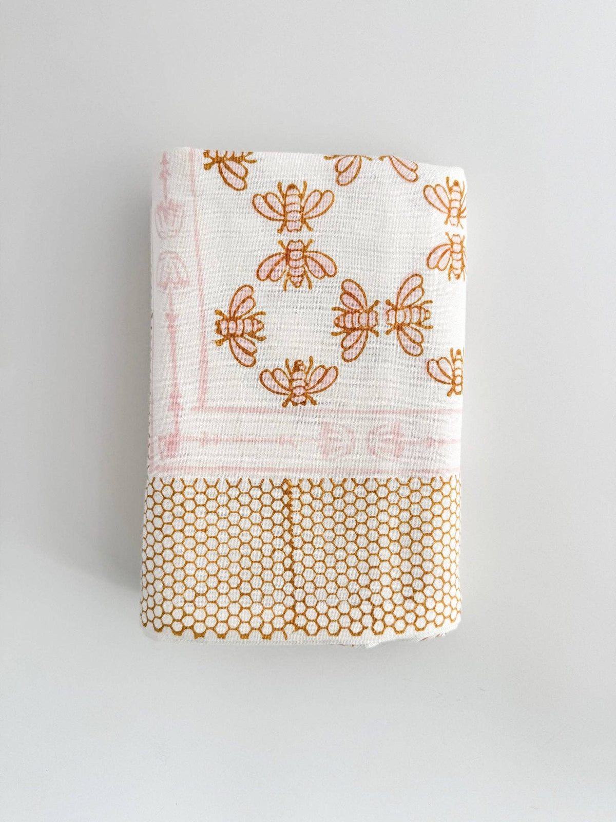 White table throw corner with honeybee print and mustard honeycomb band