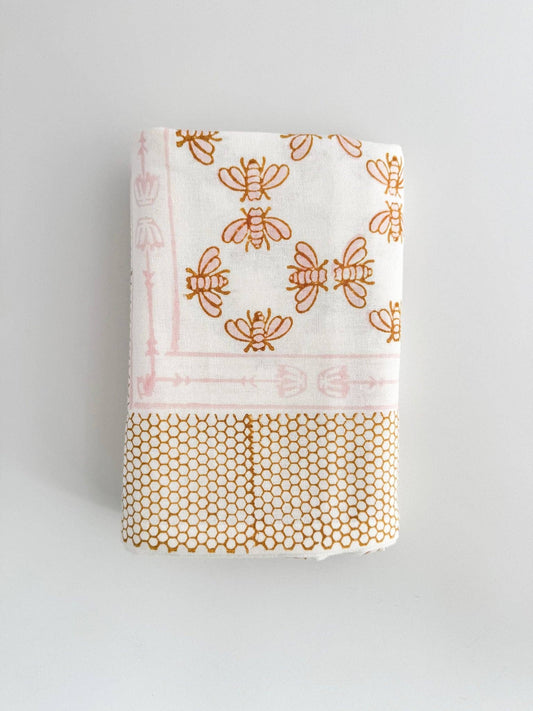 White table throw corner with honeybee print and mustard honeycomb band