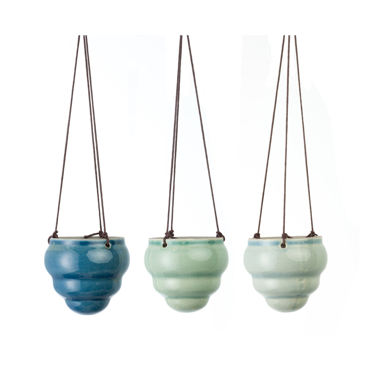 Three hanging glazed ceramic vases with blue and green pots and brown cords