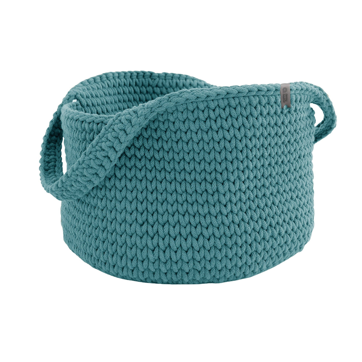 Teal round knit basket with side handles, textured fabric and rolled edge.