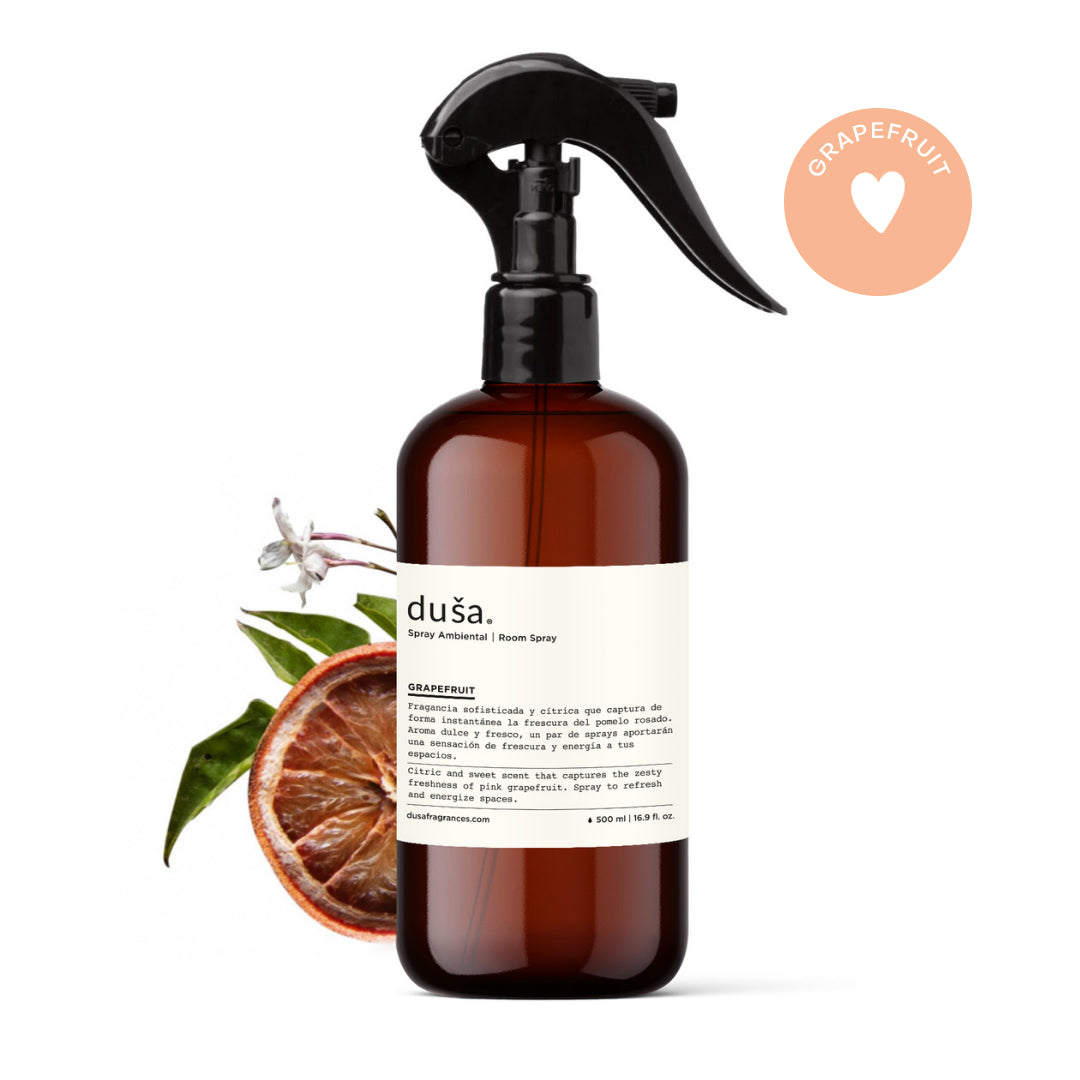 Amber room and linen spray bottle with black trigger cap and grapefruit label