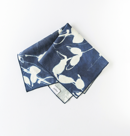 Indigo napkins with white Porto floral print, folded set with small label