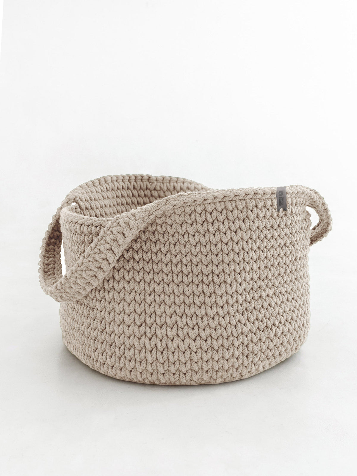 Natural beige round rope basket with handles, braided rope knit