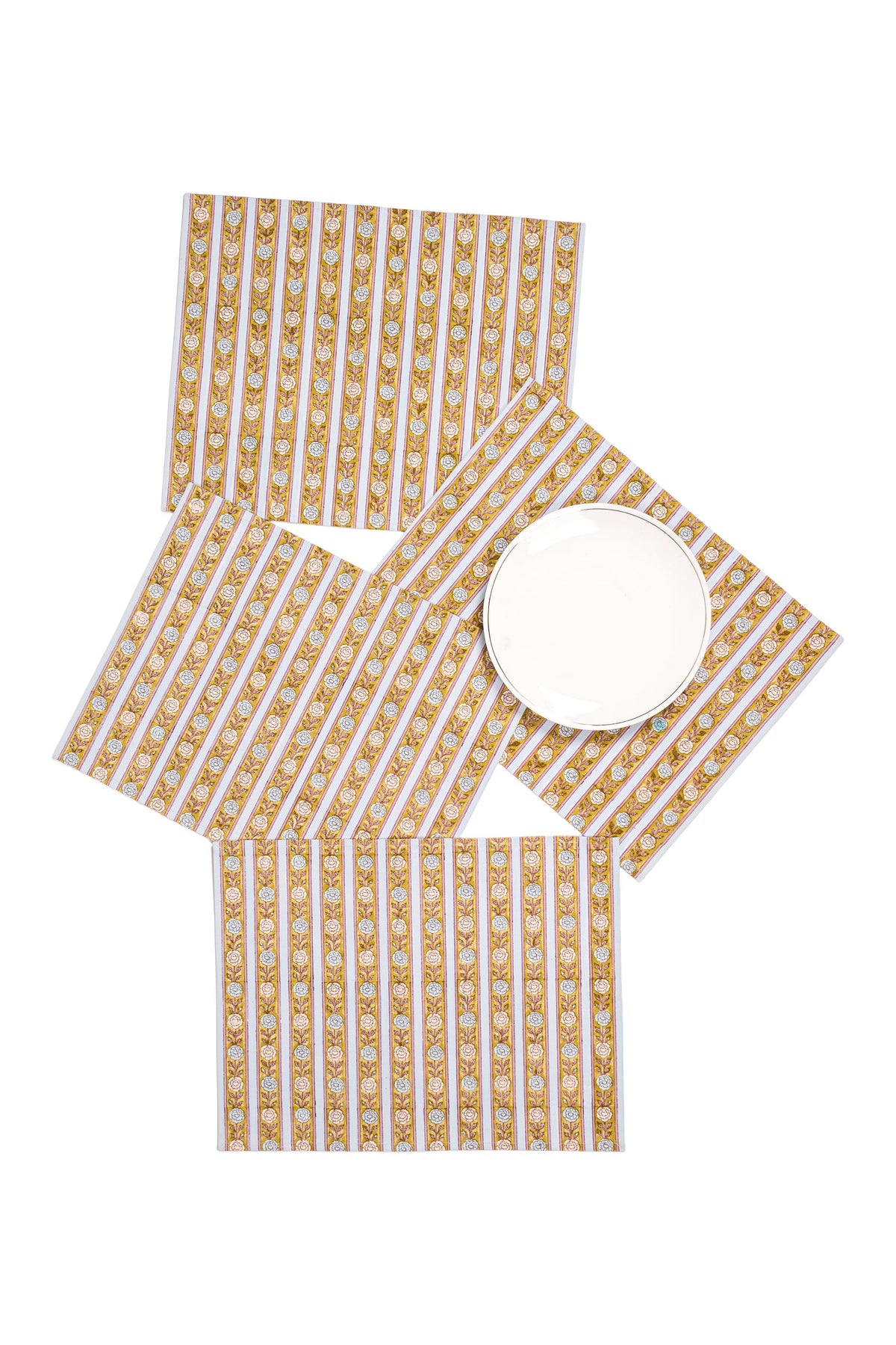 Yellow-orange floral striped placemats with round plate at center