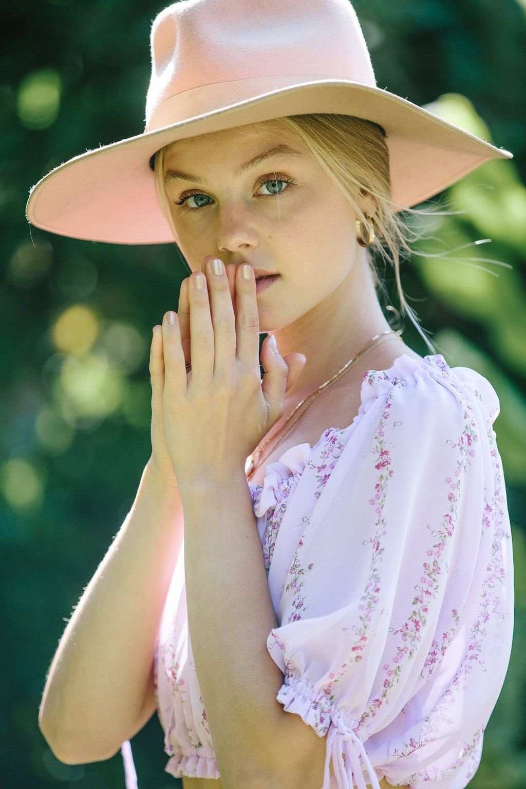 Light purple floral cropped blouse with puff sleeves and gathered neckline, front view