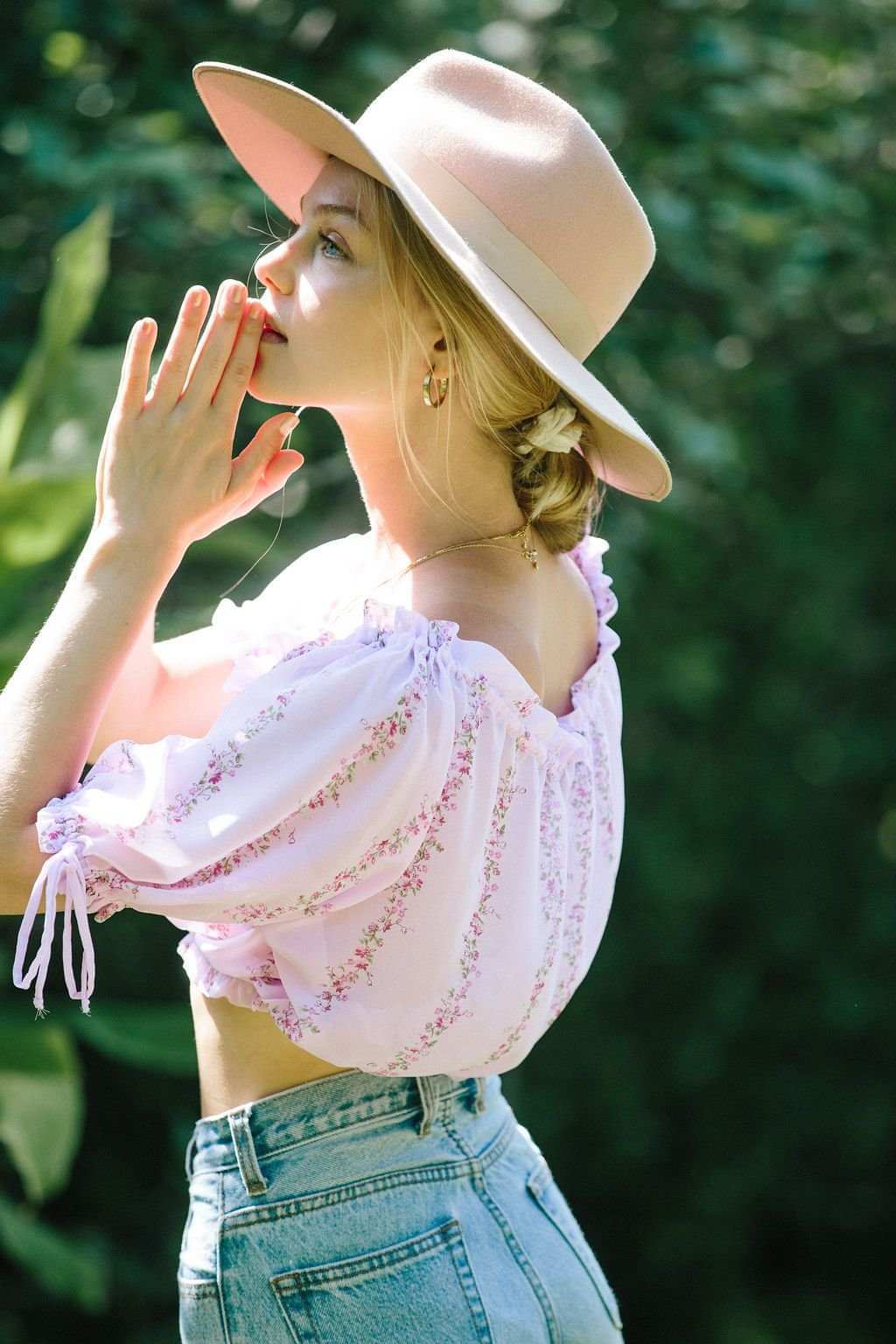 Light purple floral cropped blouse with off-shoulder puff sleeves and side tie bows