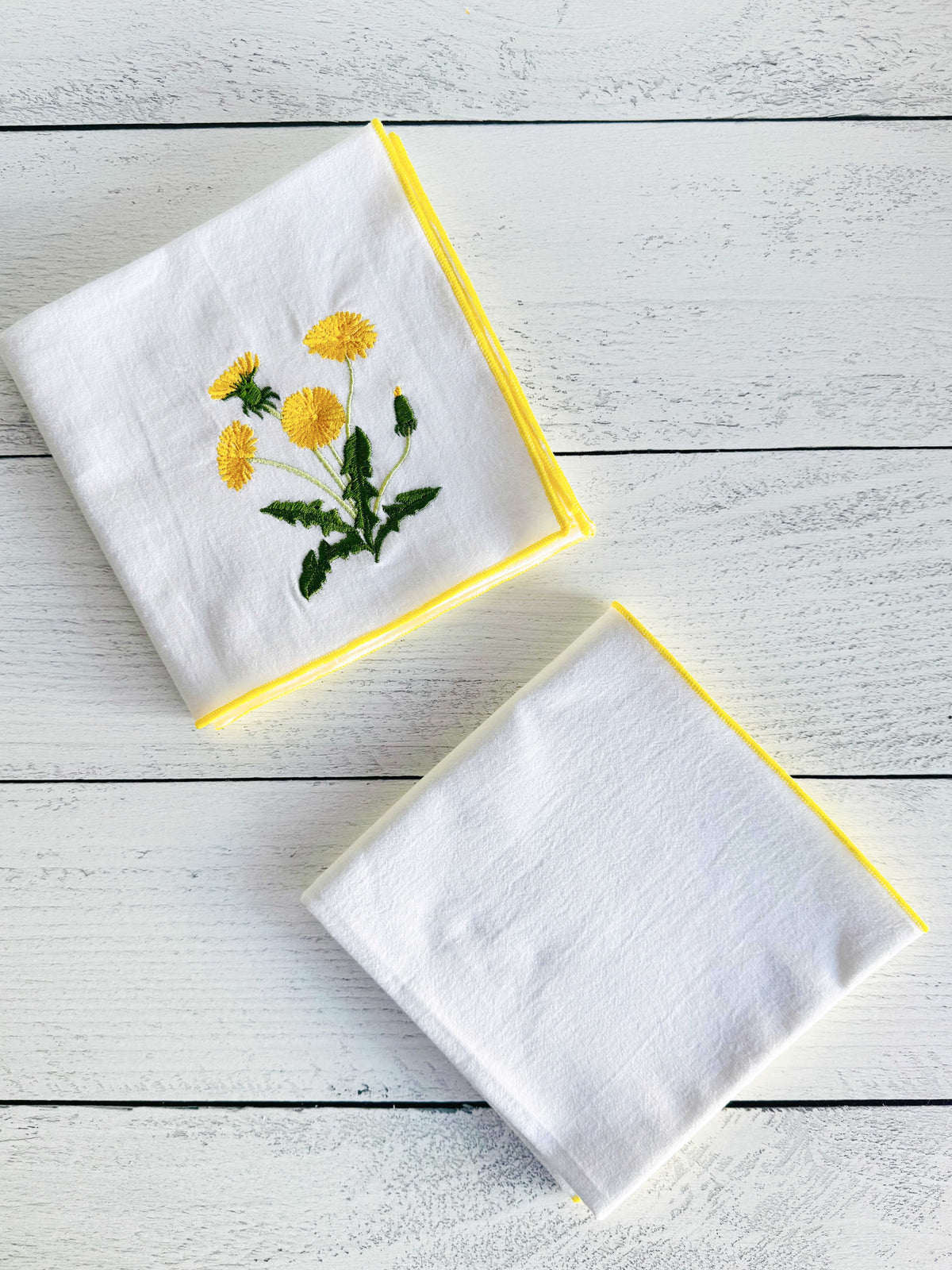 Flour sack towel set of two, one white towel with yellow dandelion embroidery, one plain