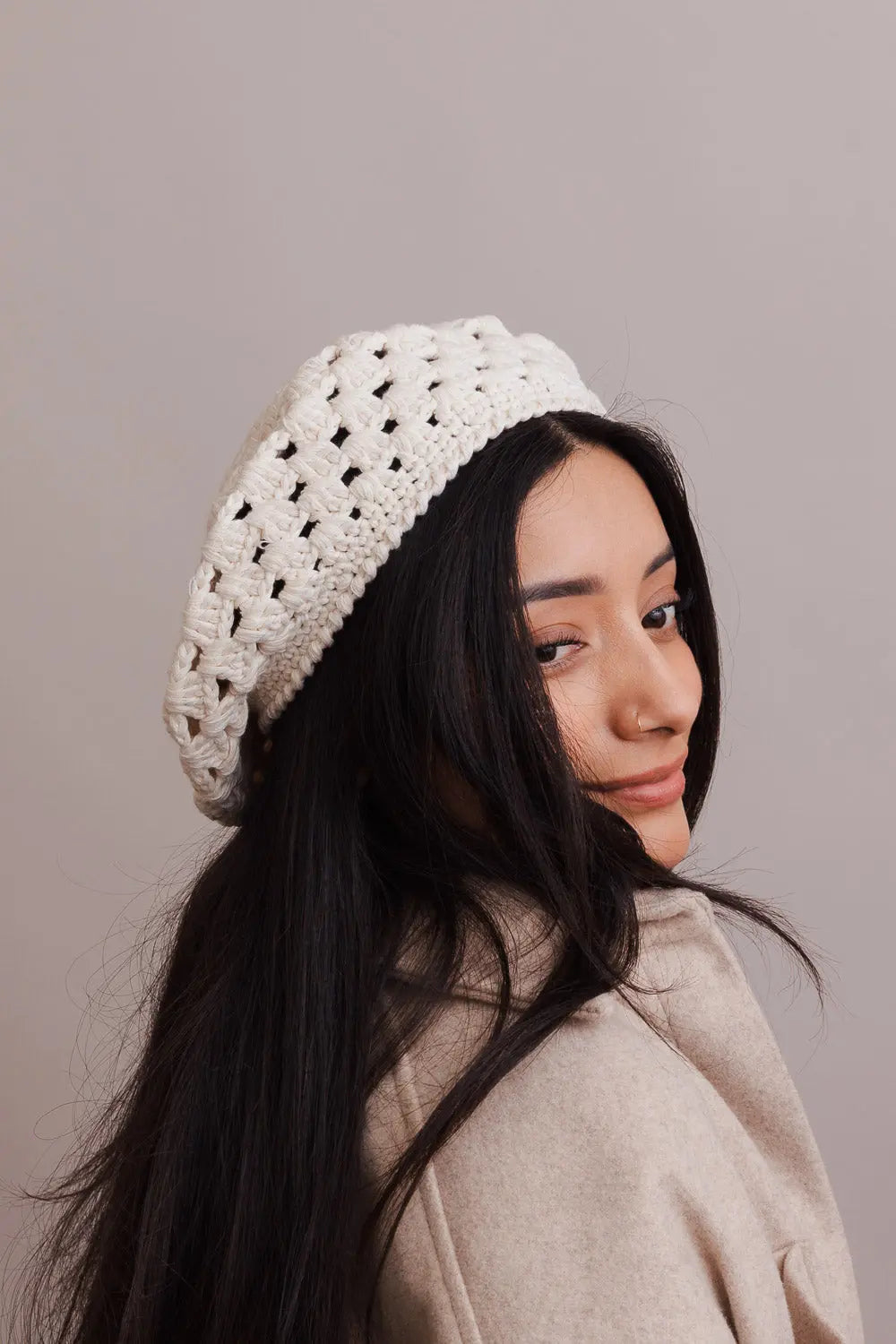 Ivory crochet knit beret with diamond stitch, worn side profile