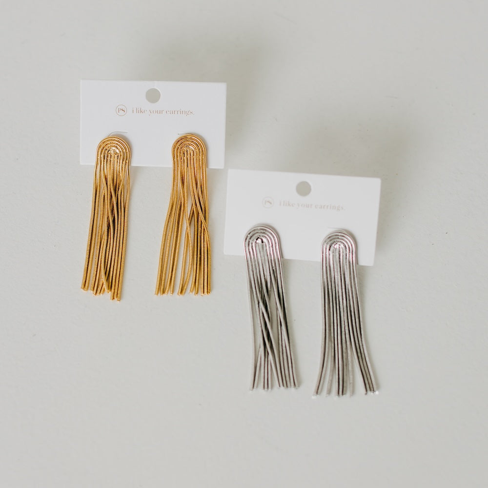 Tassel earrings set showing gold and silver pairs on display cards