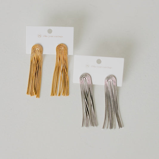 Tassel earrings set showing gold and silver pairs on display cards