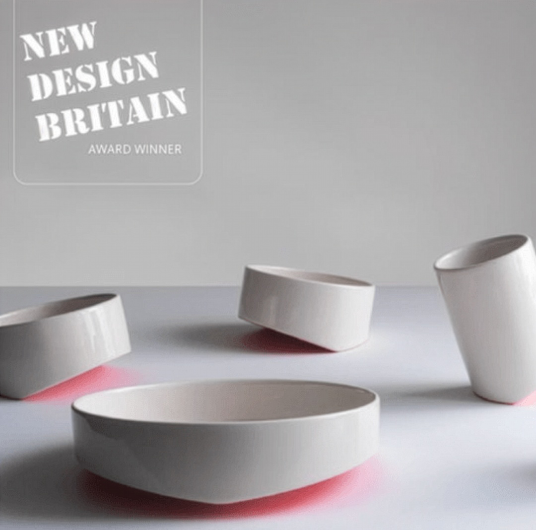 Ceramic bowl and cups set in matte white, with open rims visible