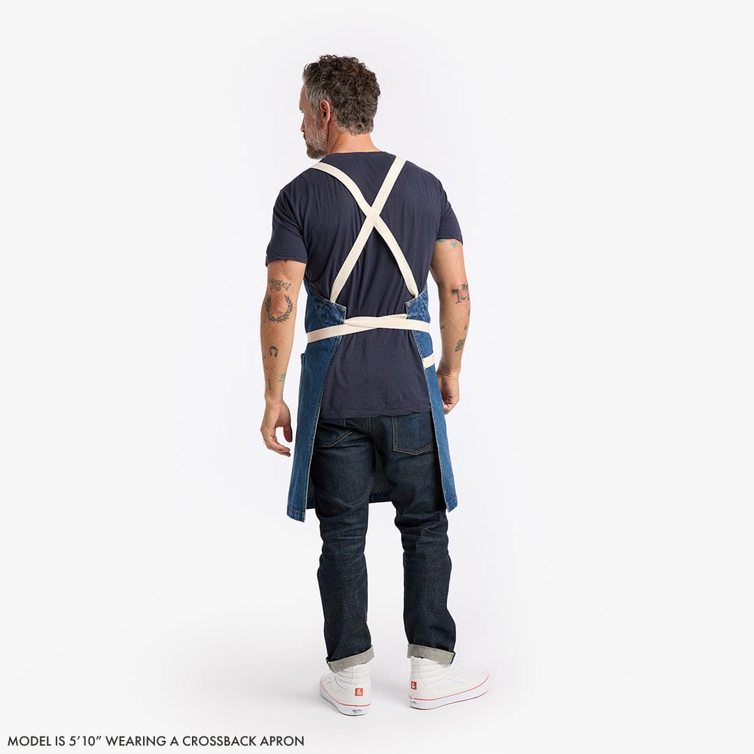 Crossback apron back view with light straps forming an X and tie at waist.
