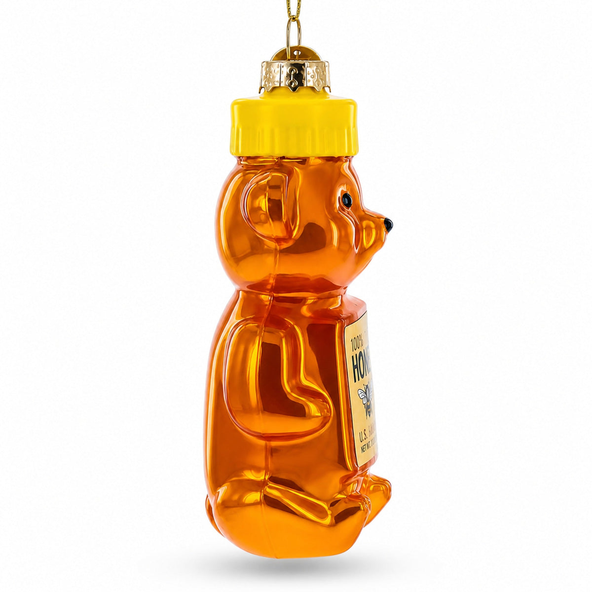 Glass honey bear ornament side view with yellow cap and partial label detail