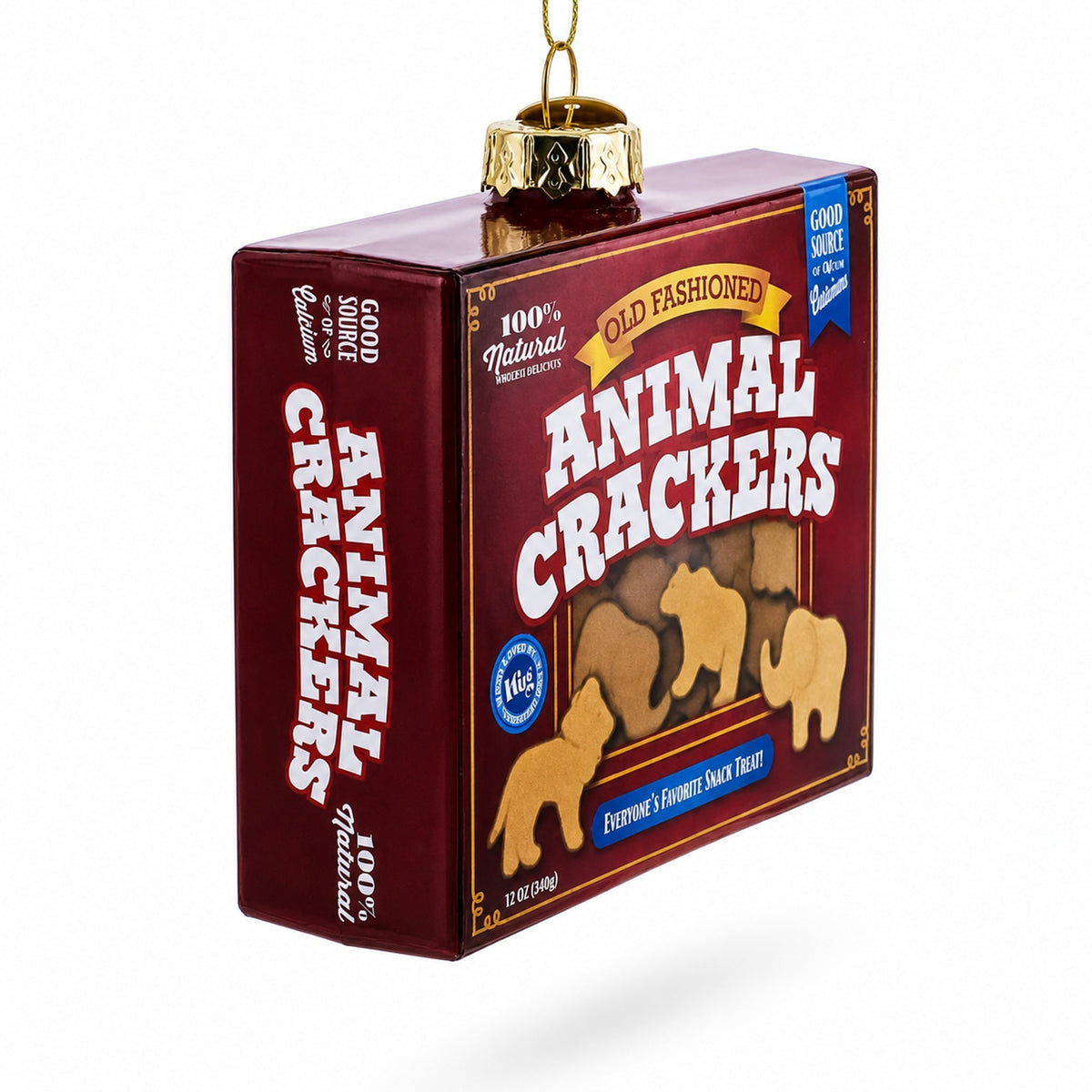Animal cracker-themed glass ornament box with gold cap and hanging loop, angled view