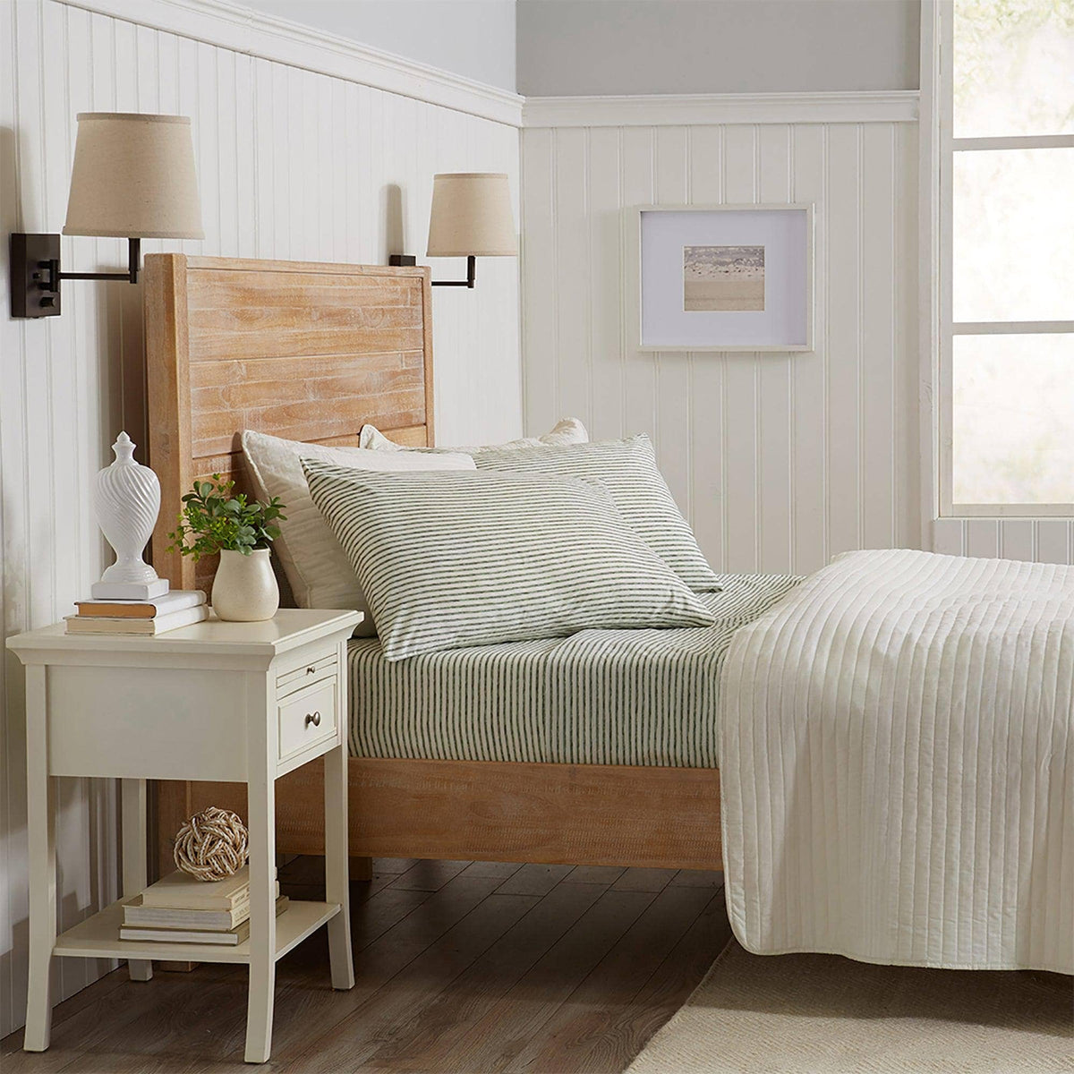 Striped microfiber sheet set on bed, white with green stripes and matching pillowcases