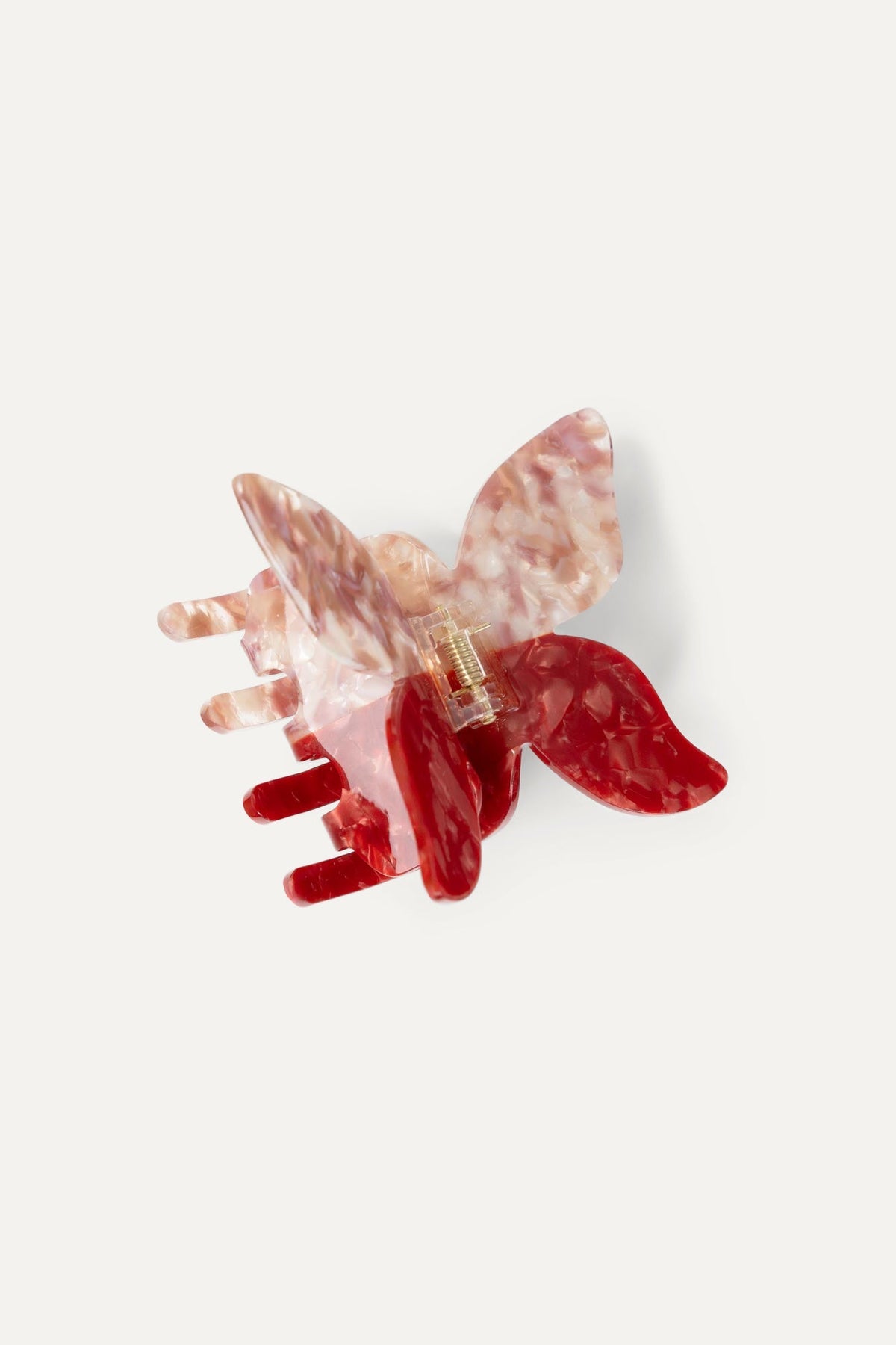 Butterfly hair claw with translucent pink and ruby red marbled petals and teeth